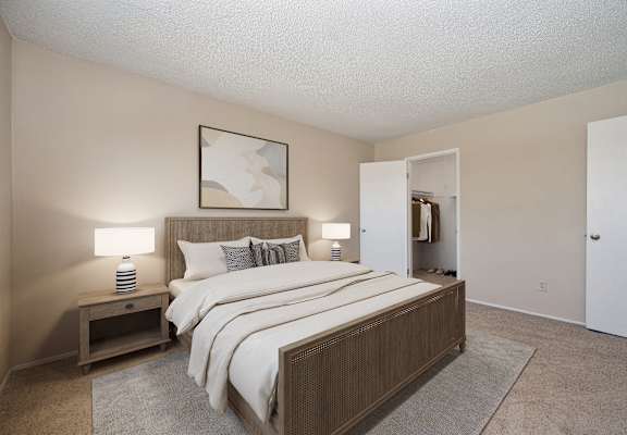 a bedroom with a bed and a closet