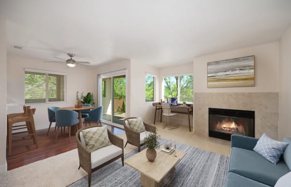 a living room with a fireplace and a table with chairs at Folsom Ranch, California, 95630
