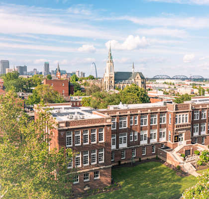 an aerial view of the physics building and the city