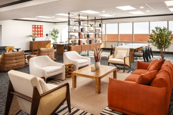 a living room filled with furniture and a table with chairs  at Vision on Lombard, Baltimore, MD