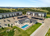 Thumbnail 1 of 10 - an aerial view of an apartment building with a swimming pool