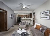Thumbnail 16 of 26 - large living room with ceiling fans, kitchen counters, and cozy furniture