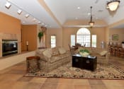 Thumbnail 8 of 12 - Interior Club House Fire Place Couch Orlando Florida