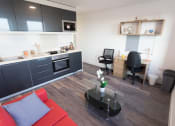 Thumbnail 5 of 8 - an overhead view of a kitchen and living room in a one bedroom apartment