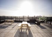 Thumbnail 3 of 8 - a picnic table on a roof terrace with a view of the city