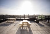 Thumbnail 7 of 8 - a picnic table on a roof terrace with a view of the city