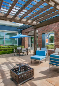 the preserve at ballantyne commons pool area with patio furniture and umbrellas