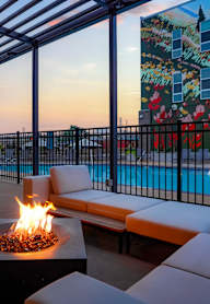 a group of people holding up glasses of beer