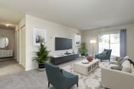 a living room filled with furniture and a flat screen tv