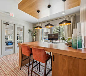 A modern living room with a dining table and chairs.