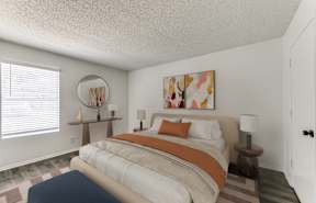 a bedroom with a bed with an orange and white comforter