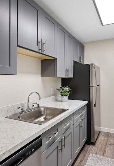 Kitchen Sink With Faucet at Pinewood Square Apartment Homes, Lynnwood, WA, 98036