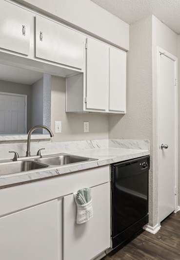 our apartments showcase a large patio with a bbq