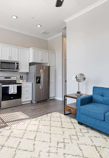 a kitchen with a counter top and a sink at Mainstreet Village, Novi, MI, 48375