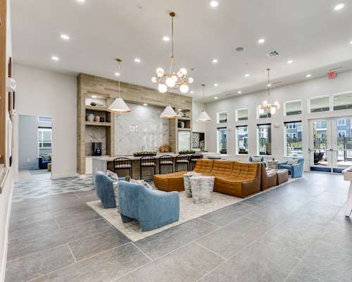Clubhouse with Kitchen and Lounge Seating at Cedar Heights Luxury Apartments in Austin, TX