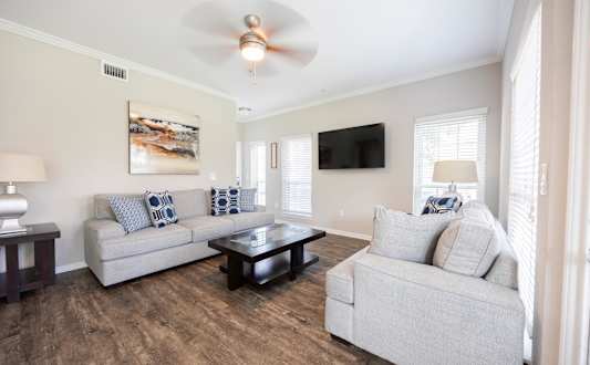 a living room with two couches and a coffee table