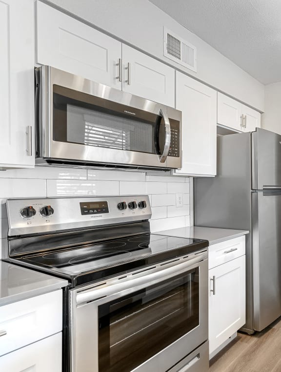 a kitchen with stainless steel appliances and a sink