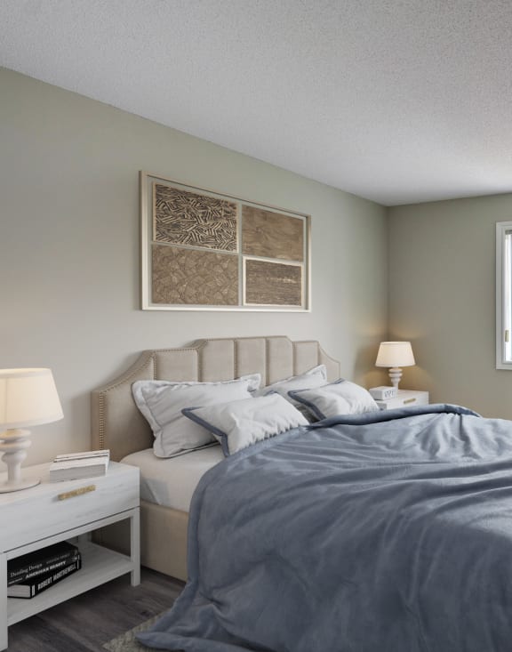 a bedroom with a bed and two windows