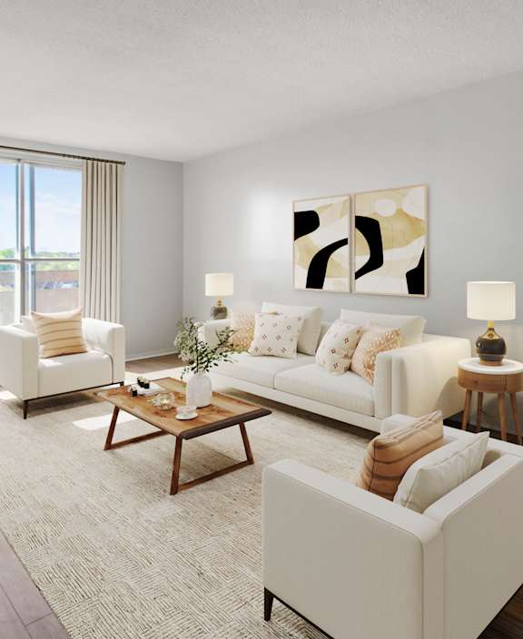 A living room with a white couch and a dining table.