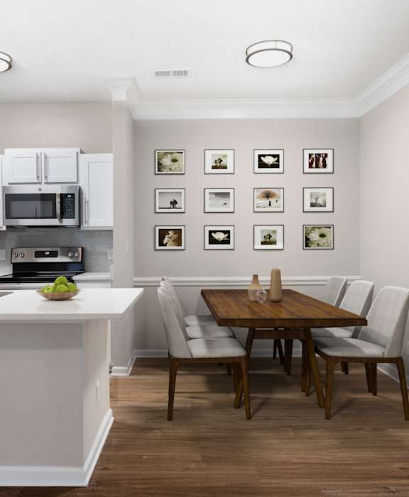 A kitchen with a dining table and chairs.at Greys Harbor at Lake Norman, Huntersville, NC 28078