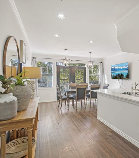 A modern kitchen with dark wood cabinets and a white countertop.