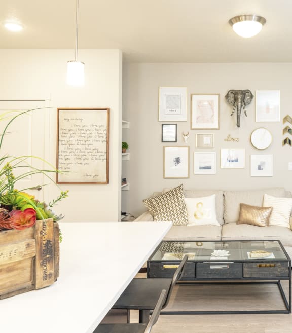 a living room with a couch and a table with a coffee table in front of it