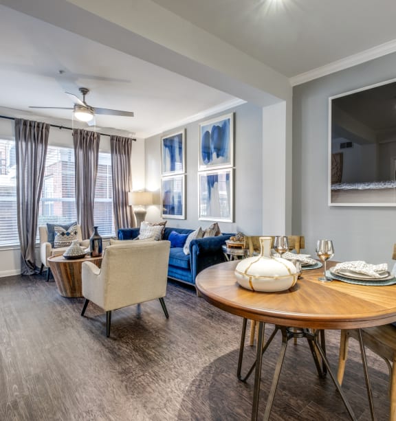 a living room with a couch and a dining room table