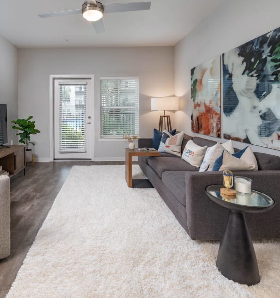 an open living room with a couch and a tv