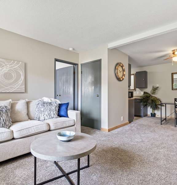 a living room with a couch and a table