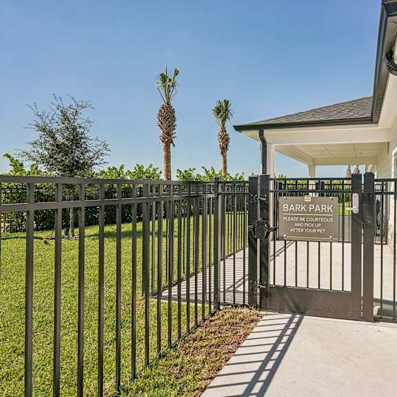 A patio with a table and chairs at The Stadler Luxury Apartments, Bradenton