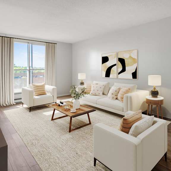 A living room with a grey couch, a round table, and a television.