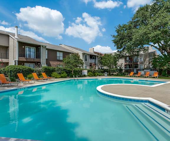 the preserve at ballantyne commons community swimming pool with orange chairs and apartment buildings