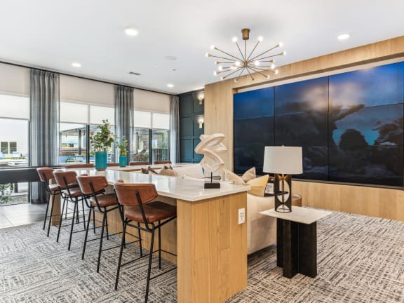 a conference room with a table and chairs and a large painting