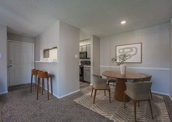 a living room with leather furniture and a glass coffee table at Paces Crossing, Denton, 76210