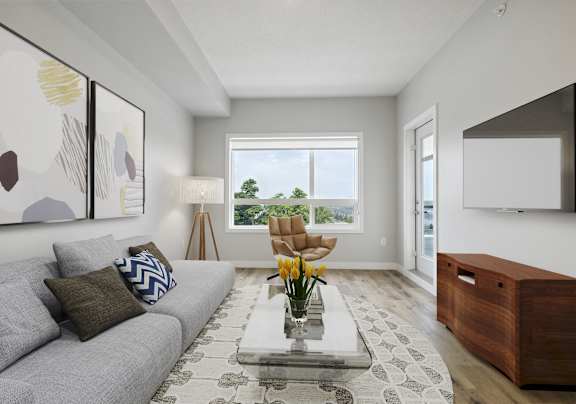 a living room with a gray couch and a coffee table
