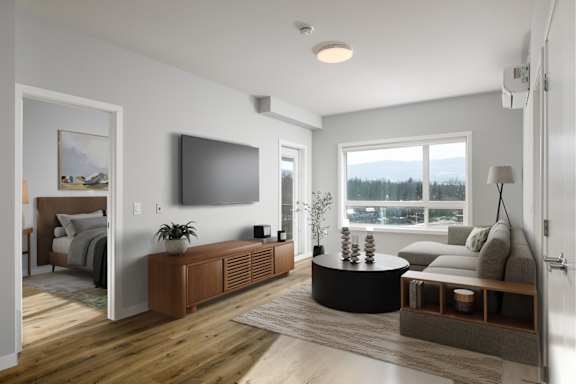 A modern living room with a flat screen TV mounted on the wall.