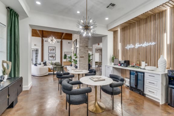 a living room with a kitchen and a dining room