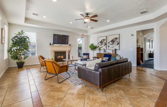 a living room with a couch and a chair and a fireplace