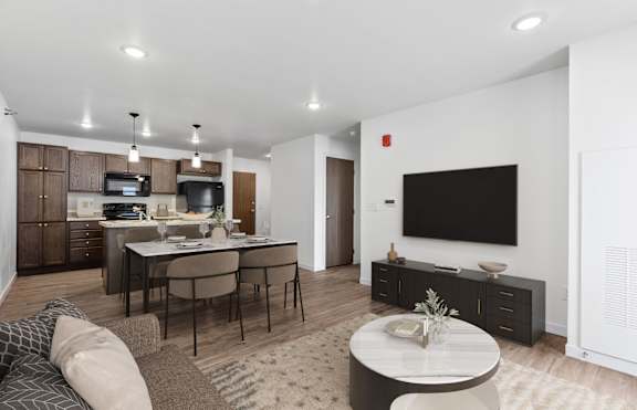 an empty kitchen with black appliances and wooden cabinets