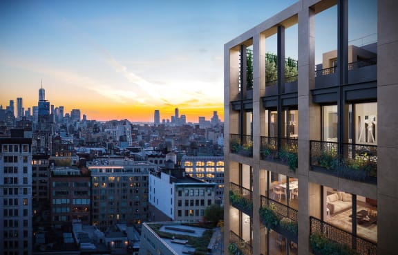 a rendering of a building with a sunset in the background