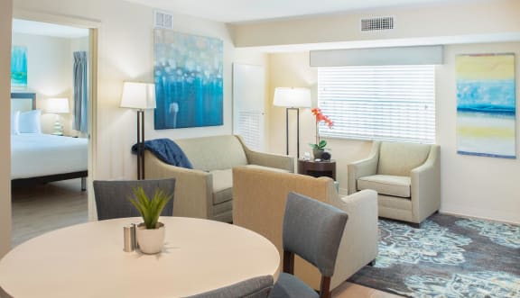 a living room with a table and chairs at Parks Residential - Richardson, Richardson, 75082
