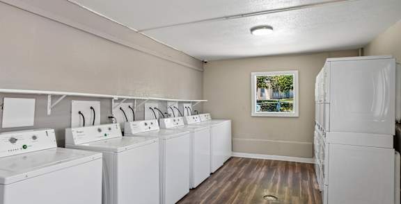 A row of washing machines in a laundromat.