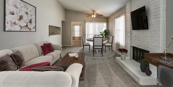 a living room with a fireplace and a sliding glass door