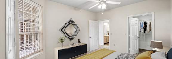 Bedroom With Ceiling Fan at The Claremont Apartment Homes, Overland Park Kansas