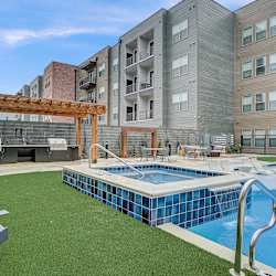 our apartments have a large pool and lounge area with chairs