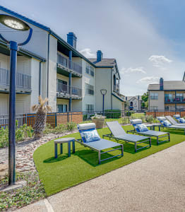 the reserve at bucklin hill leasing office patio with lounge chairs and pool