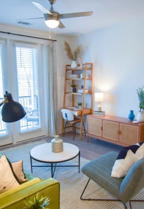 Living room with ceiling fan at The Maven, Suwanee, GA
