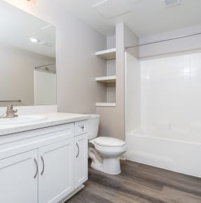 a bathroom with a toilet sink and bathtub