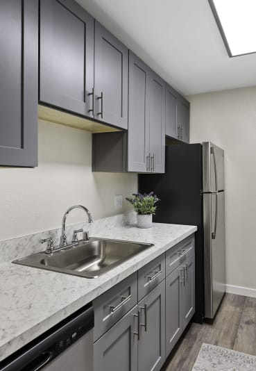 a home with a sidewalk leading to the front door at Pinewood Square Apartment Homes, Lynnwood, 98087