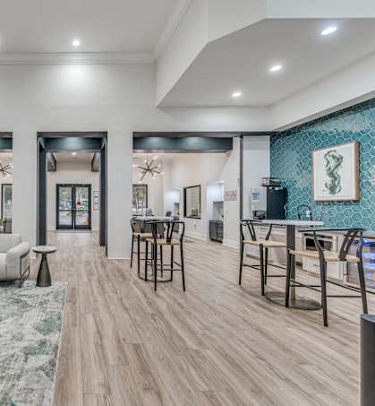 a living room and dining room with furniture and a chandelier